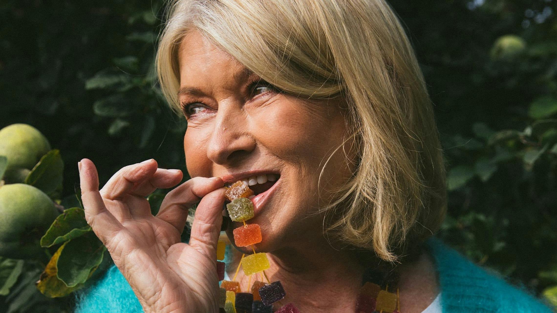 Photograph of Martha Steward eating a gummy.