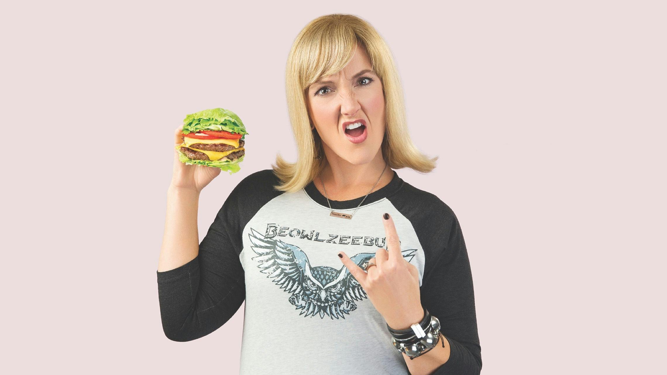 Photograph of a metal mom holding a burger.