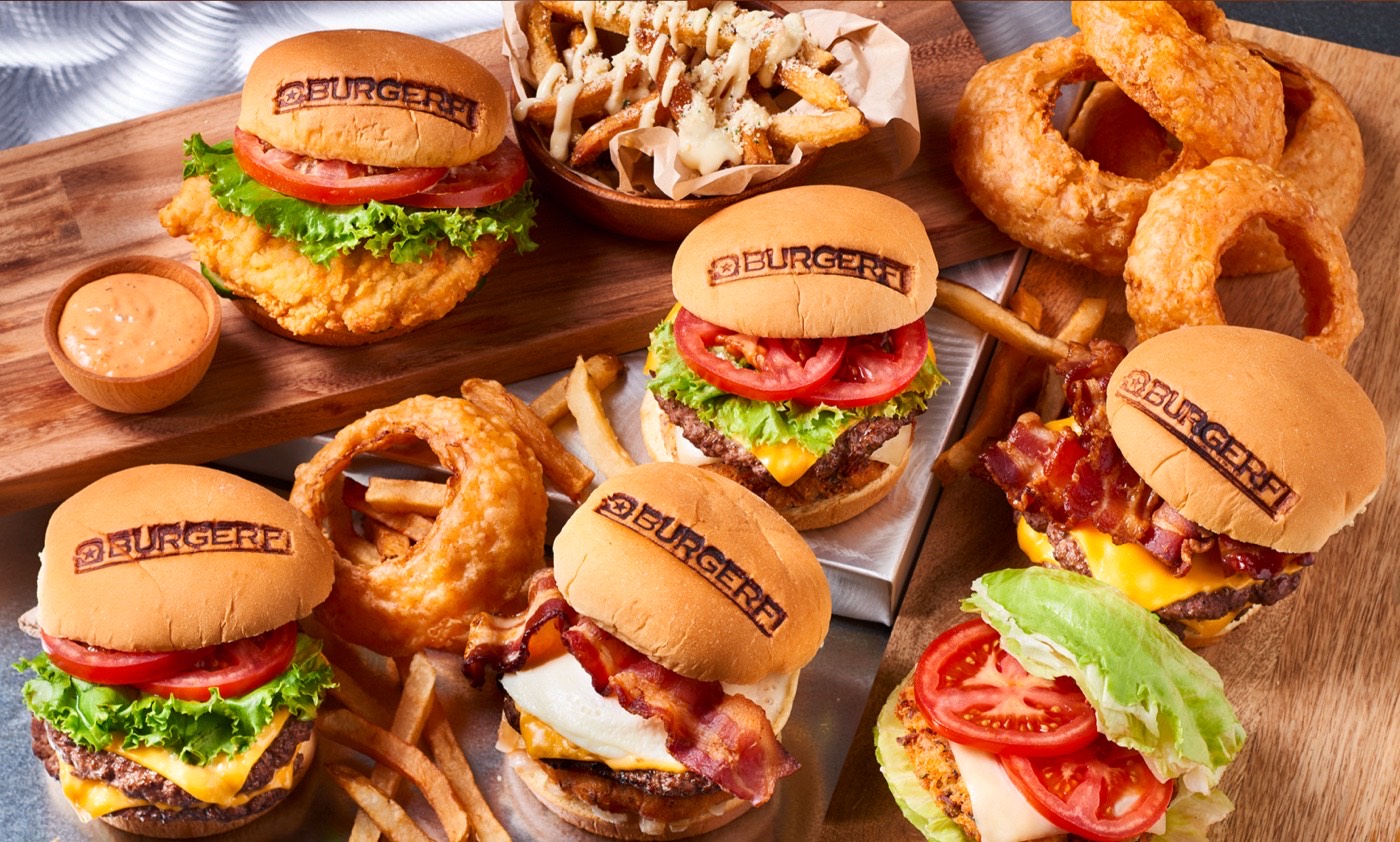 Photograph of burgers with the BurgerFi logo burned into the buns.