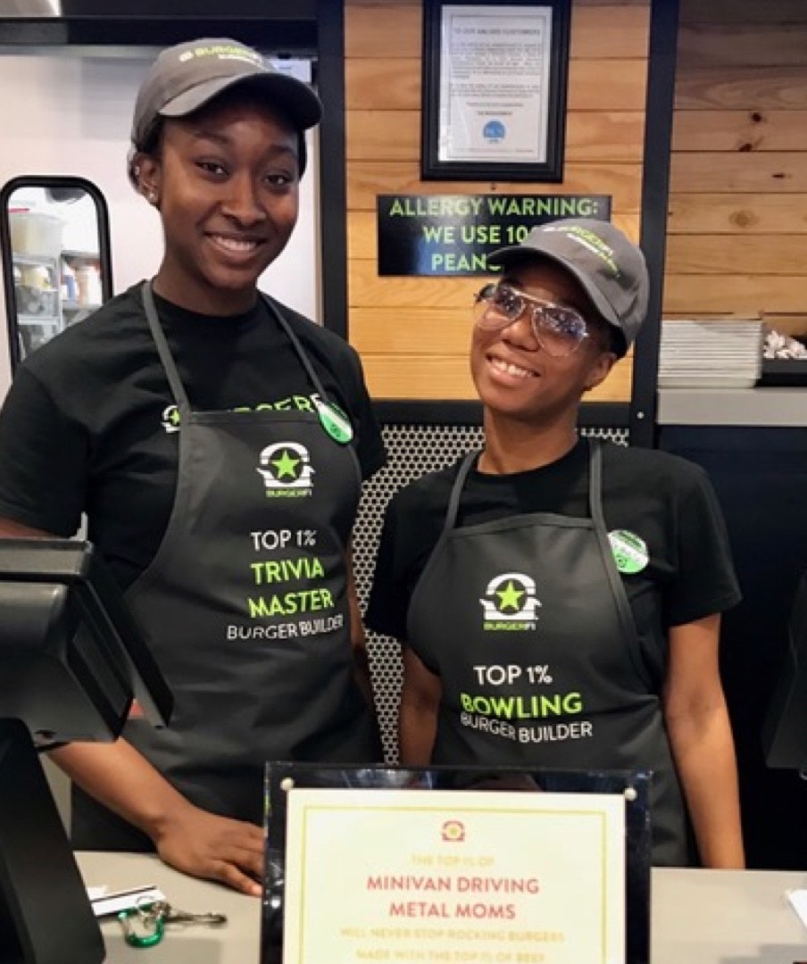 Photograph of two BurgerFi employees.