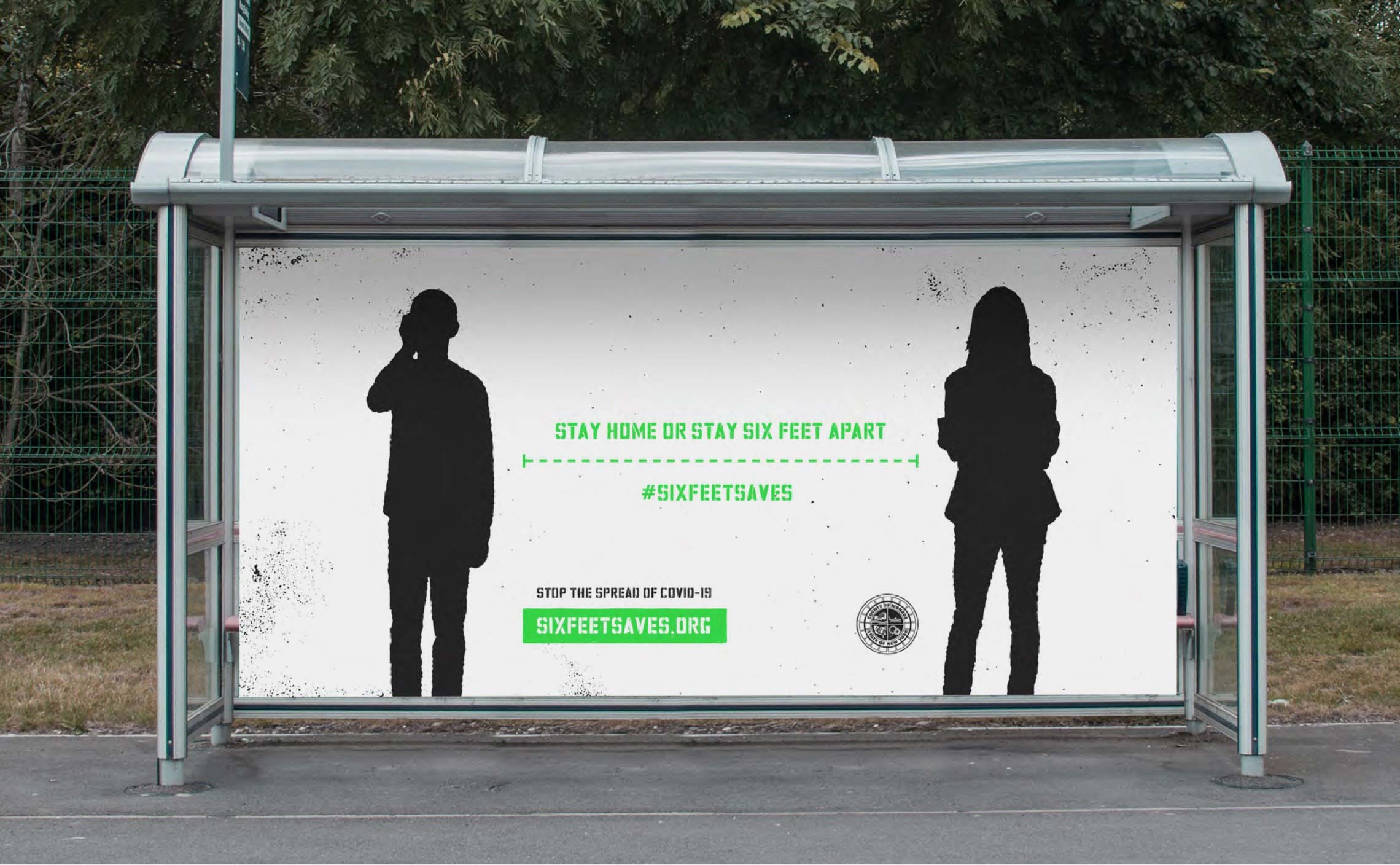 Photograph of a Six Feet Saves ad on a bus shelter.
