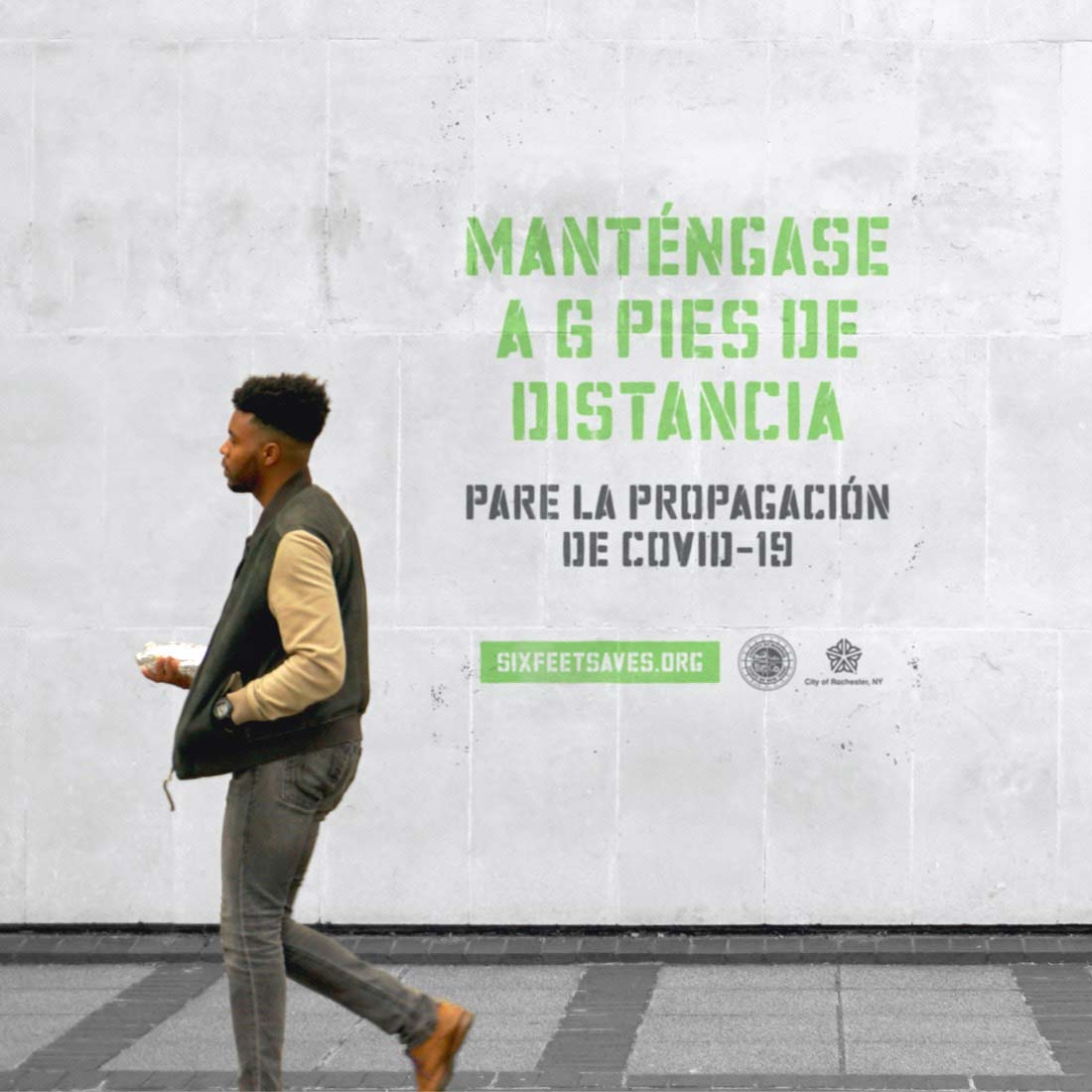 Photograph of Six Feet Saves messaging in Spanish.